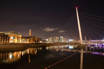Night time at the River Tawe and the Millennium bridge in Swansea