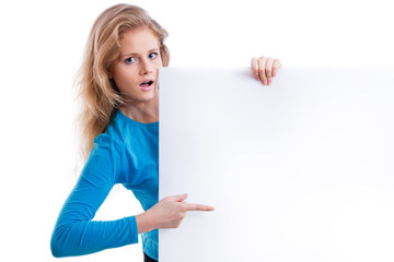 beautiful blond girl holding an empty white board