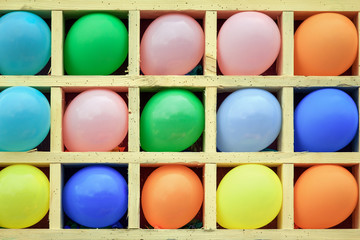 Balloons in wooden cells with Darts. Games on holidays. Photos for your design.
