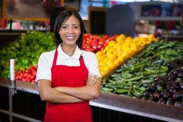 Smiling staff standing with arms crossed