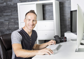 Handsome photographer camera office