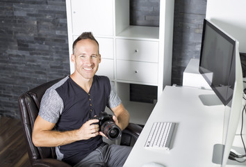 Fototapeta premium Handsome photographer camera office