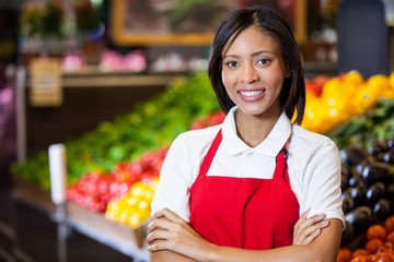 staff standing with arms crossed in organic section