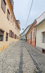 Fototapeta na wymiar The paved streets near downtown of Sibiu, Romania