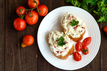 Sandwiches with pate cheese, garlic, slices of pepper, dill. Organic health food. A healthy breakfast. The top view