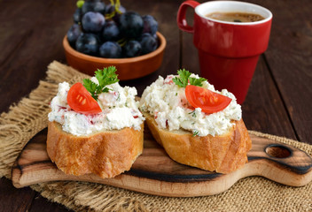 Sandwiches with pate cheese, garlic, slices of pepper, dill. A cup of coffee. A healthy breakfast.