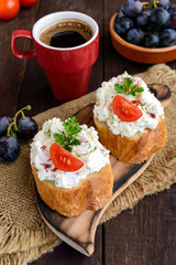 Sandwiches with pate cheese, garlic, slices of pepper, dill. A cup of coffee. A healthy breakfast.