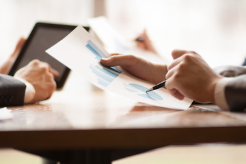 business, people, statistics and teamwork concept - close up of