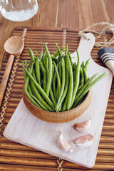 green beans in a bowl on a wooden table