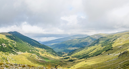 Transalpina road, Parang Mountains near clouds, hills with green grass