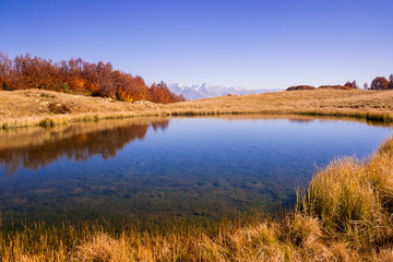beautiful Caucasian mountains and lake in autumn season