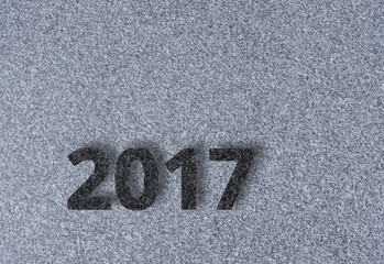 2017 Jahreszahl aus schwarzem Granit auf grauem Granit mit Textfreiraum - 2017 New Year as a number of black granite on grey granite with copyspace