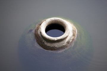 abstract of large antique earthen jar.