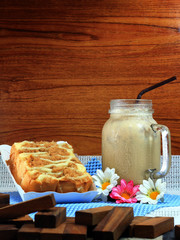 ice latte and bread topped with dried shredded pork and mayonnaise in white trays 