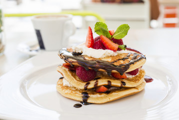 Pancakes with raspberries and strawberries