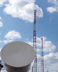 Antenna relay communication. In the background the tower with antennas mobile communications.