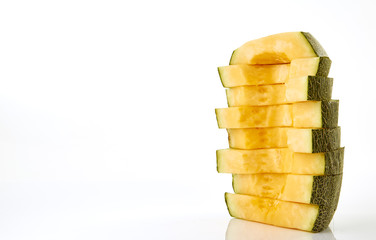 Hamigua Melon cut into slices, Hami Melon, Hami Cantaloupe isolated on white background. stack imag
