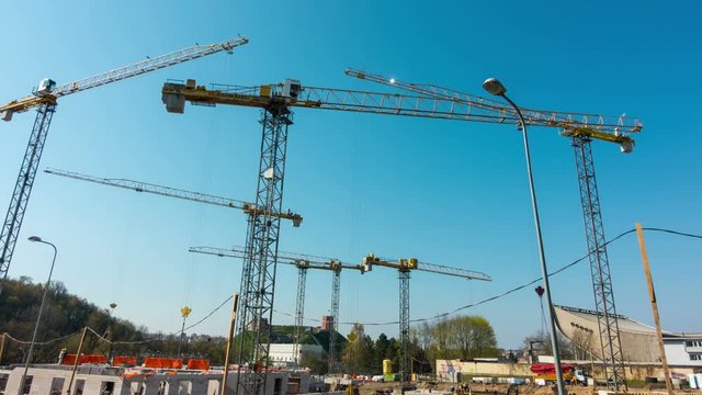 Time-lapse of construction site works with crane.