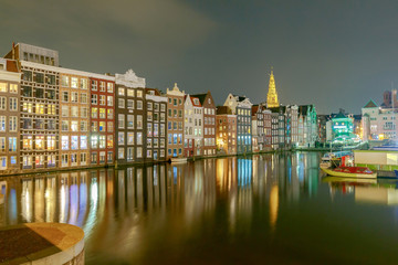 Fototapeta premium Amsterdam. Night view of the houses along the canal.