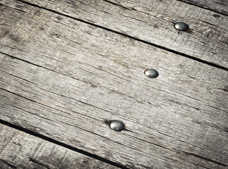 Obraz premium riveted on wooden boards