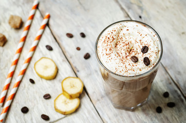 coffee chocolate banana smoothie with coconut whipped cream