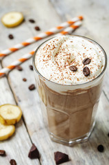 coffee chocolate banana smoothie with coconut whipped cream