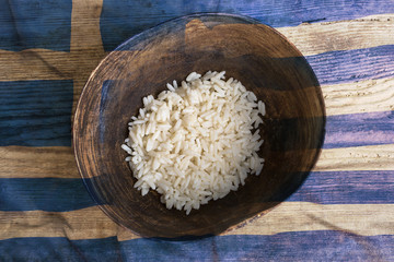 Poverty concept, bowl of rice with Greek flag