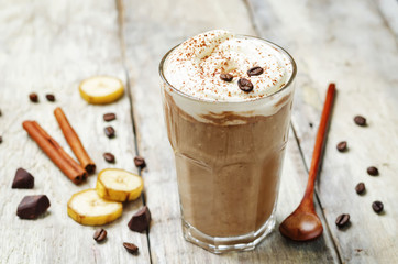 coffee chocolate banana smoothie with coconut whipped cream