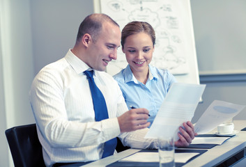 business people with papers meeting in office