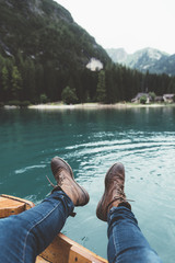 View of feet and lake from a wood boat at Braies - 121567476