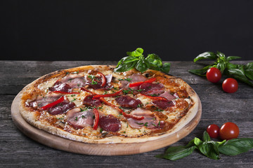 Pepperoni Pizza with salami, bacon , red pepper and green onions