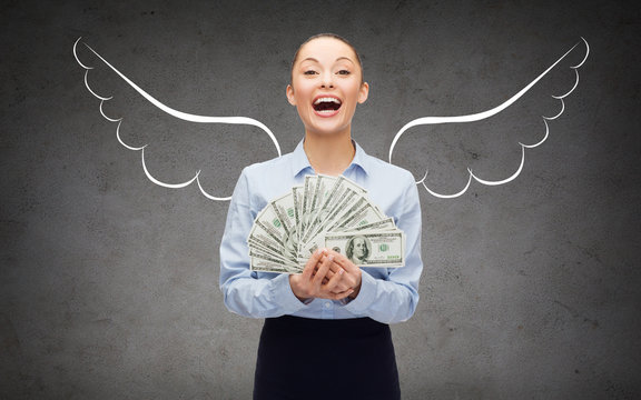 businesswoman with dollar money and angel wings