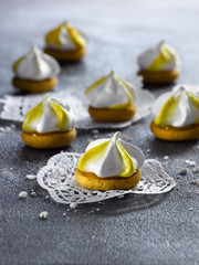 Lemon meringue cookie. Silver background.