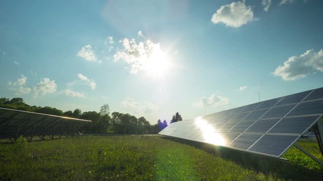Solar panel and sun, panoramic time-lapse