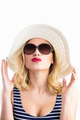 Beautiful woman posing with hat against white background