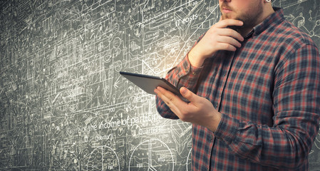 Man using digital tablet . Mixed media