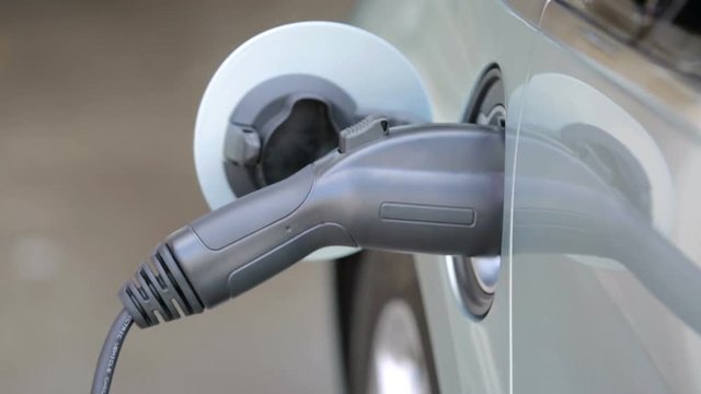 Charging electric car in residential garage