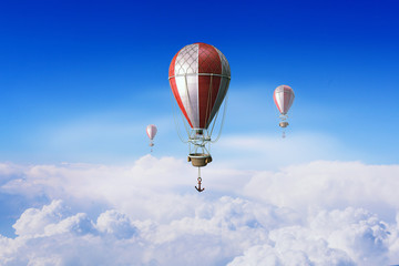 Aerostats flying over sky . Mixed media