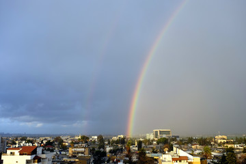 Naklejka na ściany i meble Double rainbow after rain over Lod city, Israel.