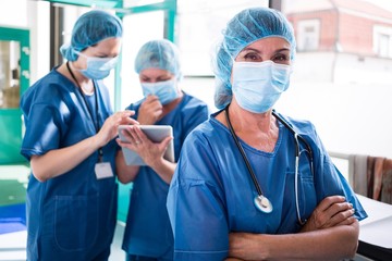 surgeon standing with arms crossed