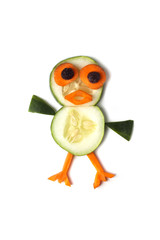 Food art creative concepts. Funny and cute animal made of cucumber and carrots isolated on a white background.