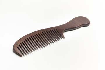Fototapeta premium wooden comb On a white background