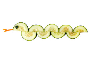 Food art creative concepts. Funny and cute animal made of cucumber and carrots isolated on a white background.