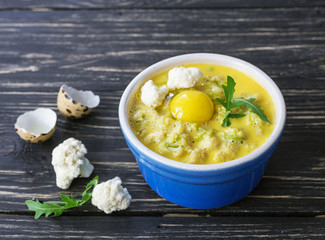 Italian cauliflower with quail eggs, arugula and spices