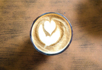 Top view of latte art foam on hot latte drink