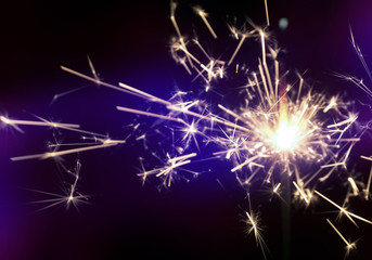 Christmas sparkler in haze with blue light