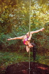 Female pole dancer in park © Andriy Petrenko