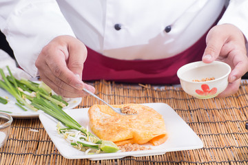 Chef decorated Pad Thai on plate