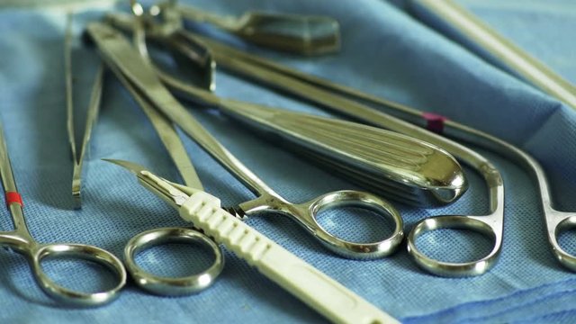 Radial dolly move around an assortment of surgical implements.