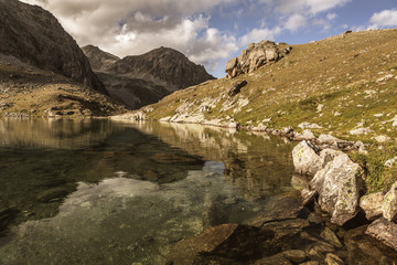 Fototapeta na wymiar Mountain landscape. Pass Uchkulan. Highland lake
